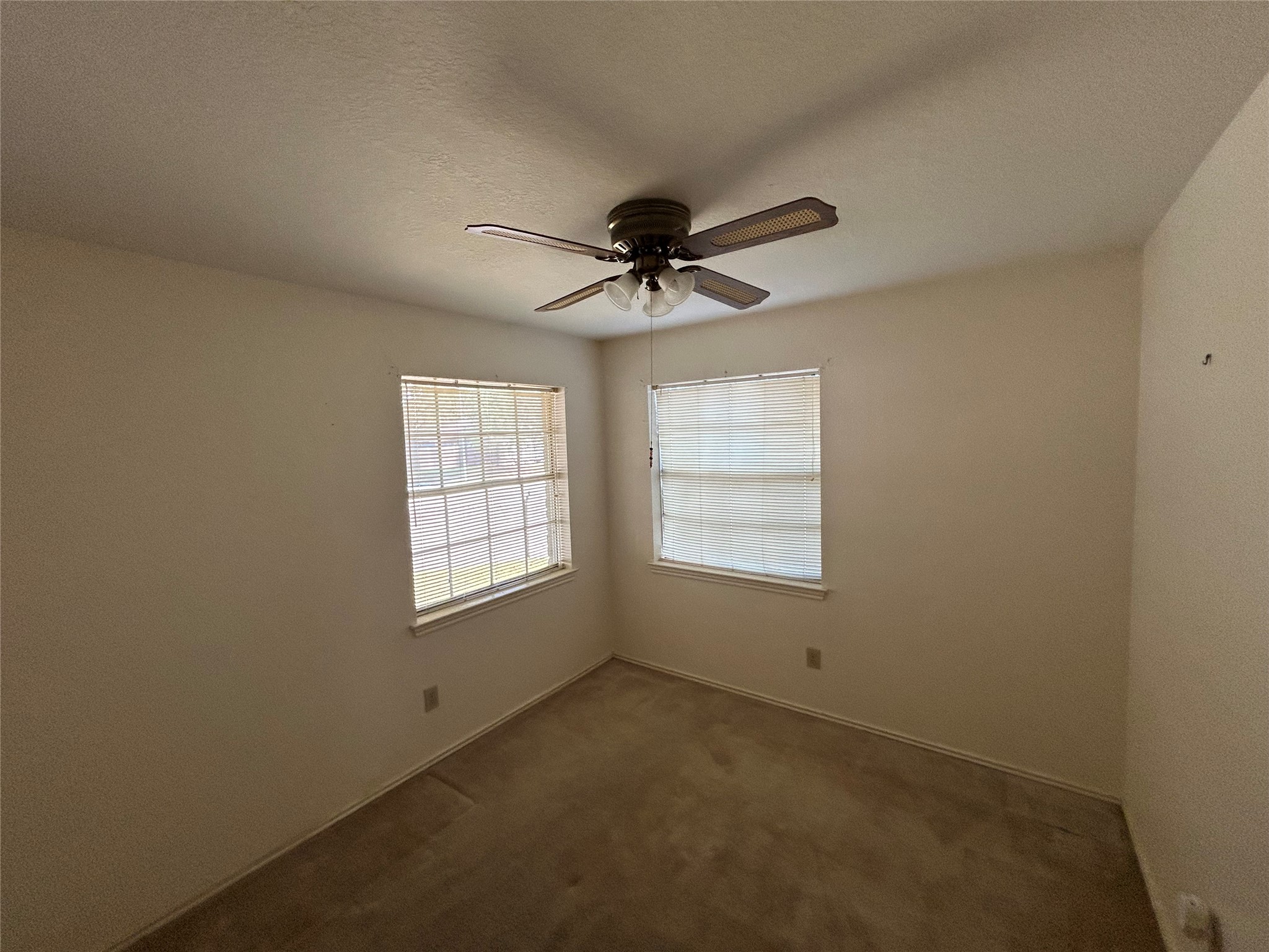 5338 Rivergate Drive Spring, TX 77373 - Photo 9 of 14 an empty room with a window and a ceiling fan