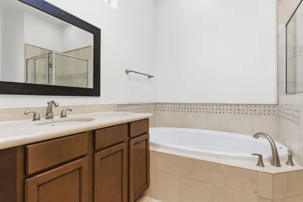 a white bath tub sitting in a bathroom