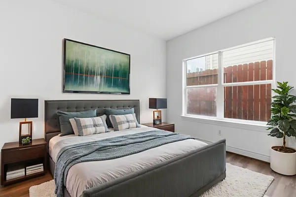 a bathroom with a toilet sink vanity and mirror