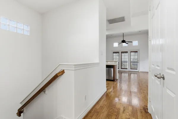 a kitchen with stainless steel appliances granite countertop a stove cabinets and wooden floor