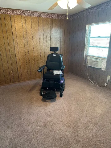 a room with a window and furniture