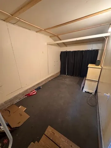 a view of a room with rack and wooden floor