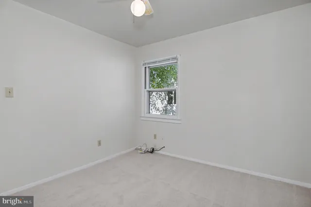 a bath tub sitting next to a white sink