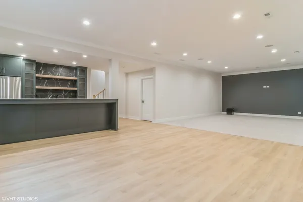 a view of kitchen and empty room