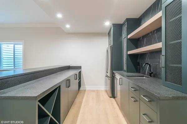 a kitchen with a sink and cabinets