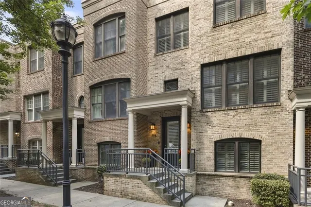 a front view of a building with a brick wall