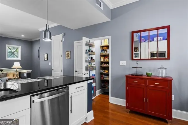 a bedroom with a bed and a lamp