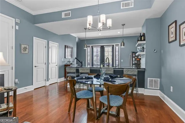 a room with furniture pool table and flat screen tv