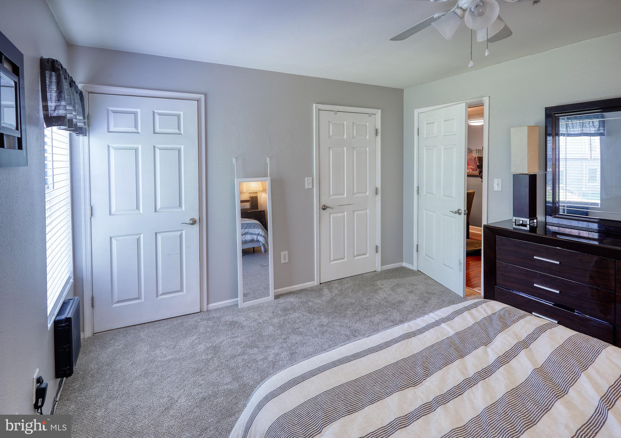 302 Canterbury Road, Unit F Bel Air, MD 21014 - Photo 12 of 26 a bedroom with a bed and a dresser