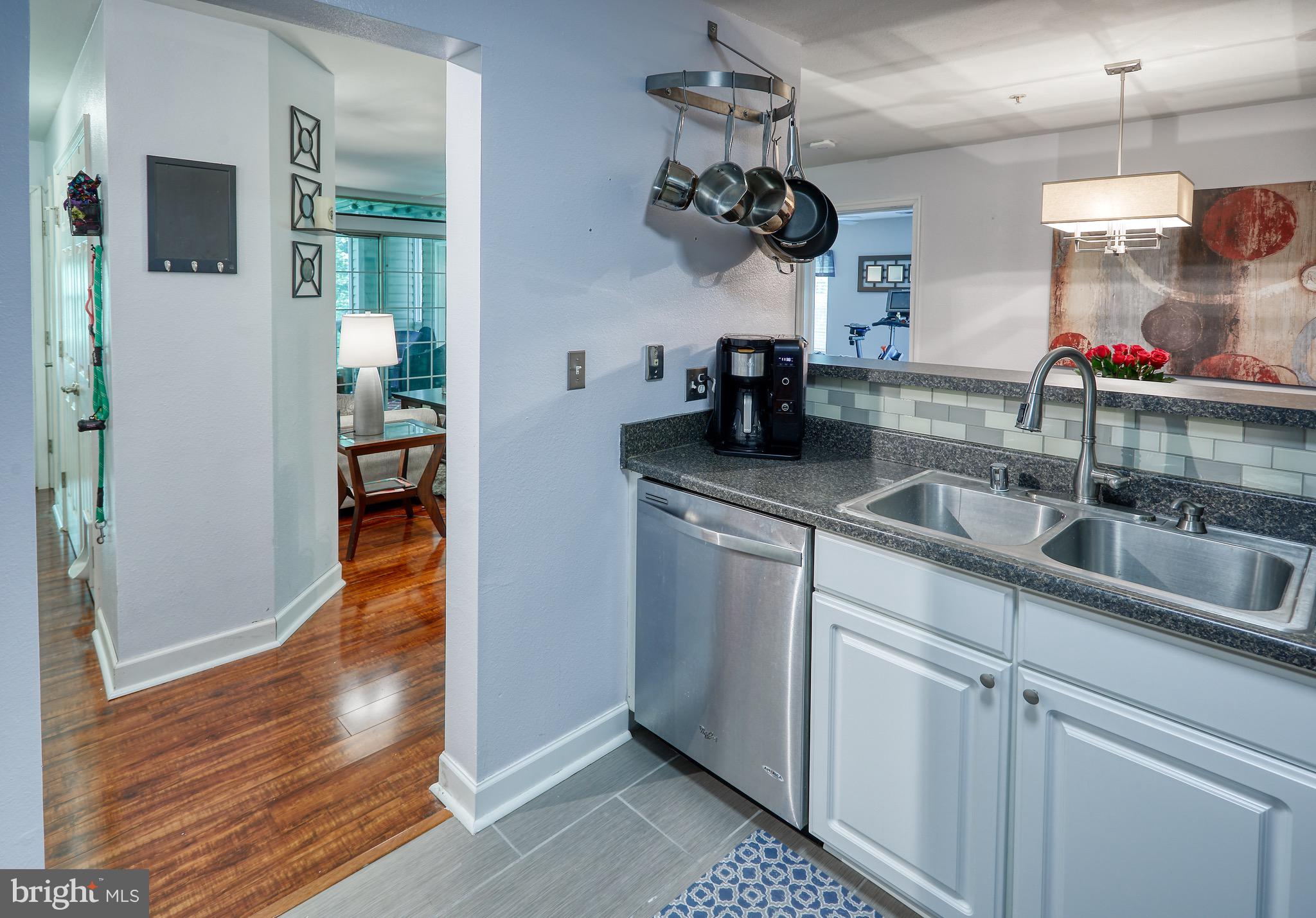 302 Canterbury Road, Unit F Bel Air, MD 21014 - Photo 3 of 26 a kitchen with sink and mirror