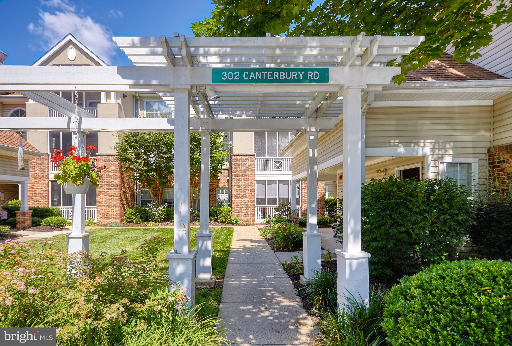 302 Canterbury Road, Unit F Bel Air, MD 21014 - Photo 26 of 26 a front view of a building with garden
