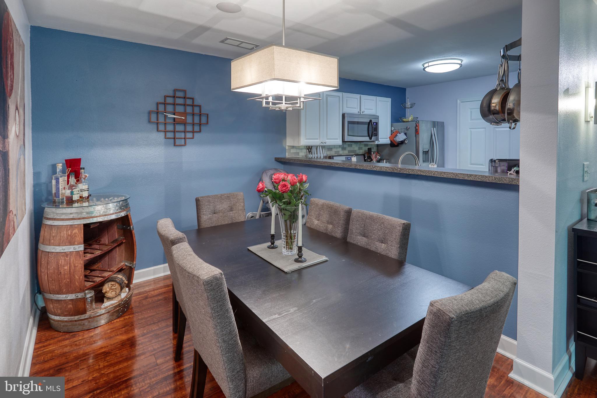 302 Canterbury Road, Unit F Bel Air, MD 21014 - Photo 4 of 26 a view of a dining room with furniture and wooden floor