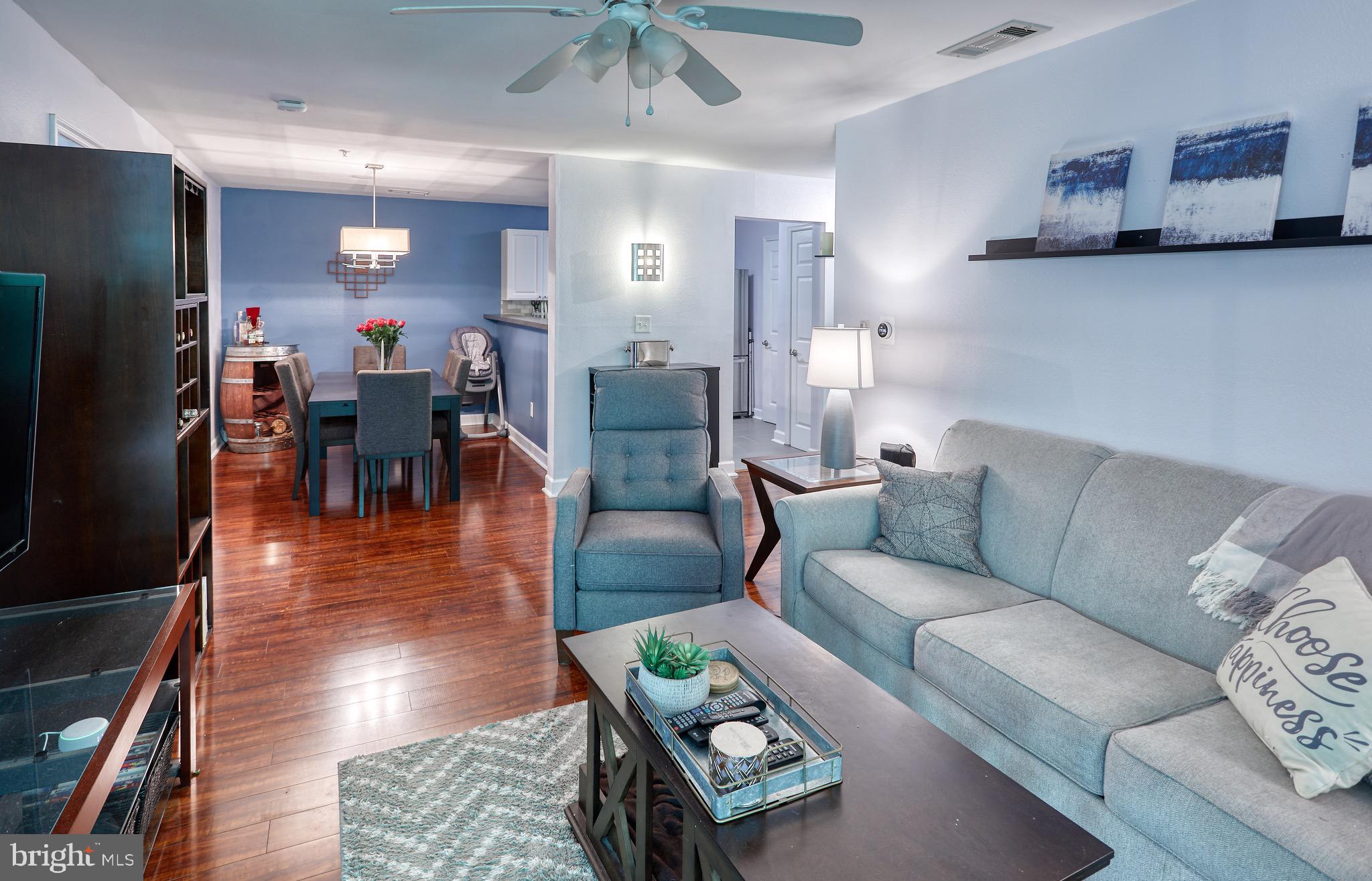 302 Canterbury Road, Unit F Bel Air, MD 21014 - Photo 5 of 26 a living room with furniture and wooden floor