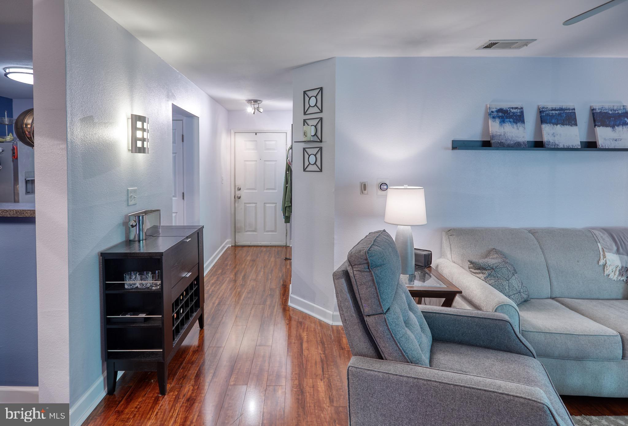 302 Canterbury Road, Unit F Bel Air, MD 21014 - Photo 7 of 26 a living room with furniture and a wooden floor