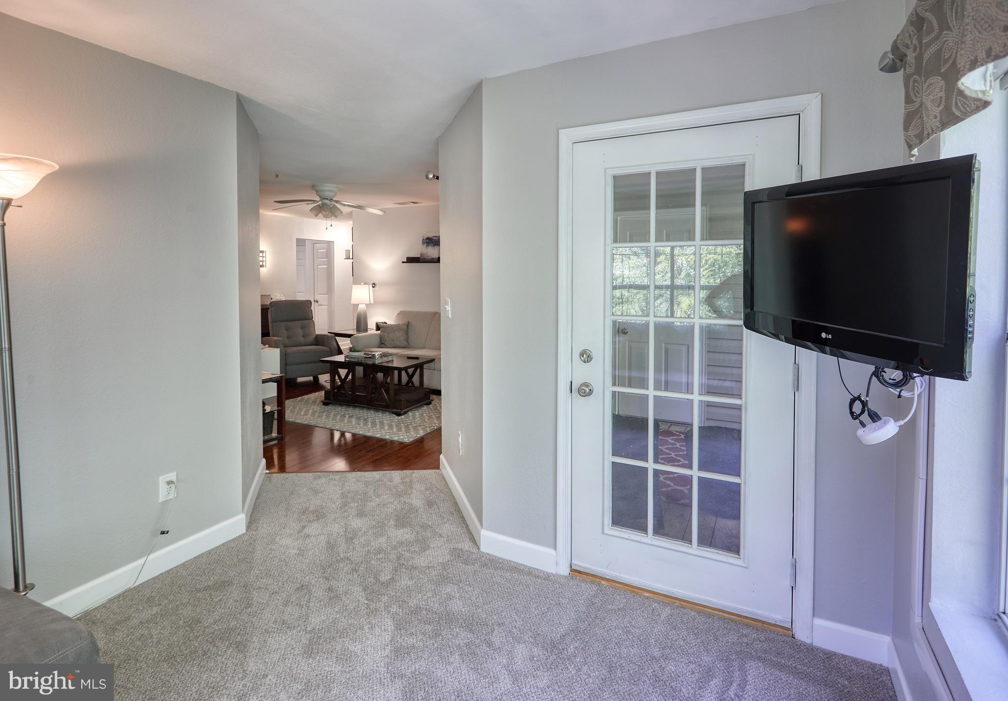 302 Canterbury Road, Unit F Bel Air, MD 21014 - Photo 10 of 26 a view of a livingroom with furniture and a flat screen tv