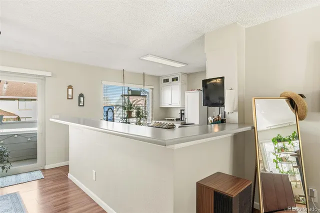 a kitchen with stainless steel appliances a sink and a refrigerator