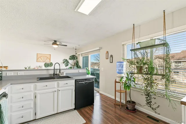 a kitchen with sink and window