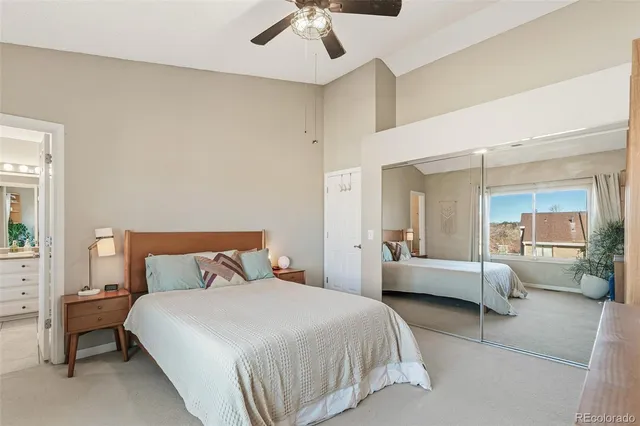 a bedroom with a bed and a couch