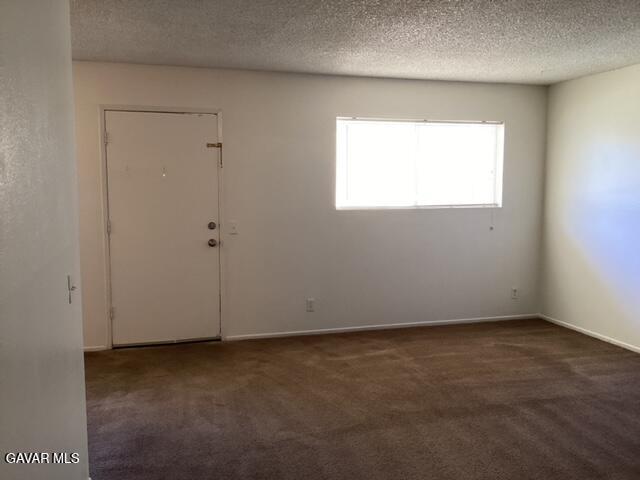 5036 West Ave L8, Unit 5 Quartz Hill, CA 93536 - Photo 4 of 9 an empty room with a window