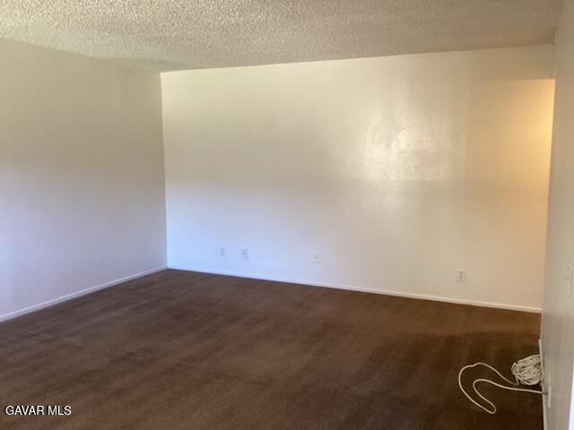 5036 West Ave L8, Unit 5 Quartz Hill, CA 93536 - Photo 5 of 9 an empty room with a door