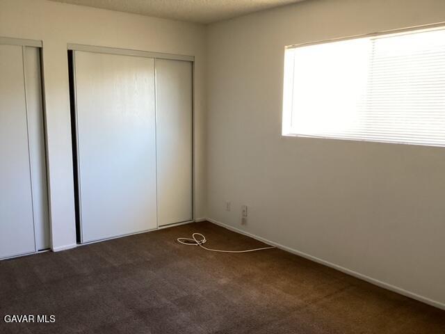5036 West Ave L8, Unit 5 Quartz Hill, CA 93536 - Photo 9 of 9 an empty room with a window