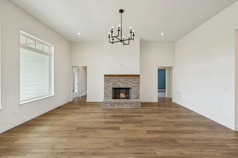 a bedroom with a bed and a potted plant
