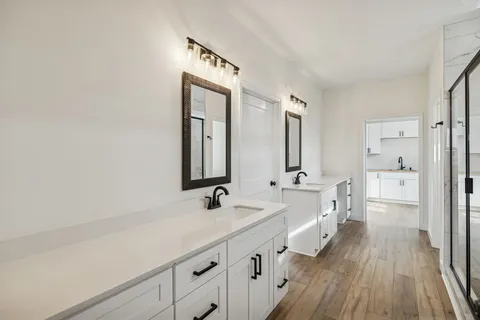 a view of a room with wooden floor