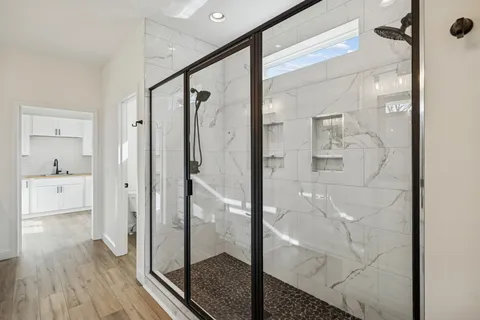 a view of entryway with wooden floor and stairs