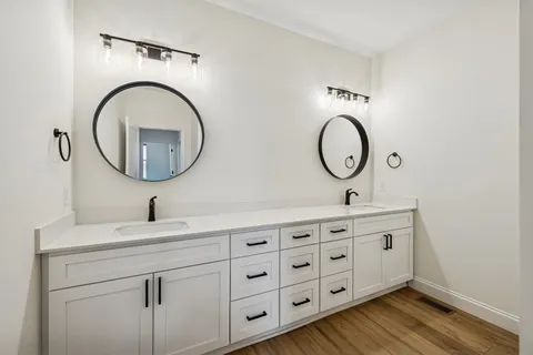 an aerial view of a residential houses with outdoor space