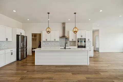 a kitchen with granite countertop a sink and a window