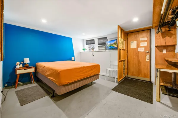 a bedroom with a bed and a cabinets