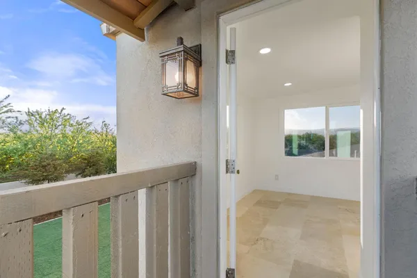a view of balcony with wooden floor