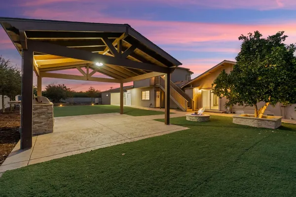 a view of a backyard of the house