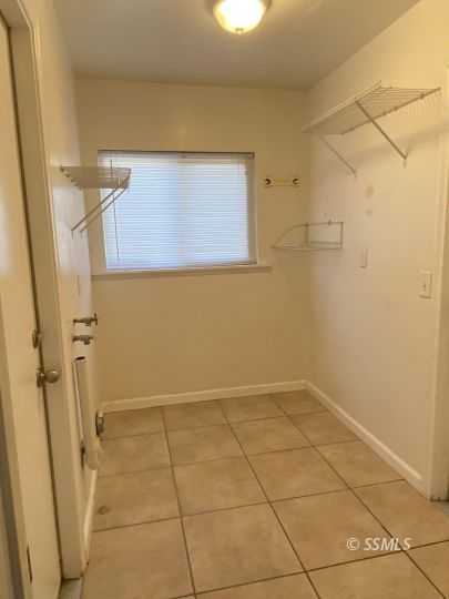1037 West St George Avenue Ridgecrest, CA 93555 - Photo 7 of 8 a view of a room with an empty space and a window