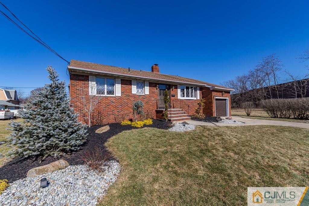 53 Rector Avenue Woodbridge, NJ 07095 - Photo 2 of 25 a front view of a house with garden