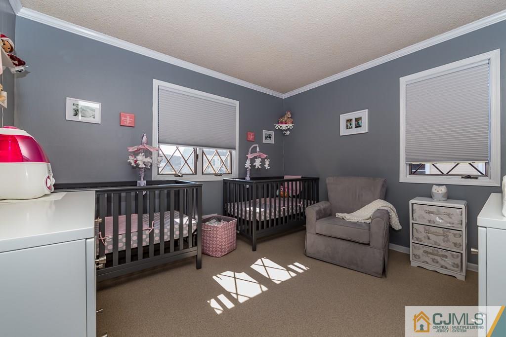 53 Rector Avenue Woodbridge, NJ 07095 - Photo 20 of 25 a bedroom with furniture and wooden floor