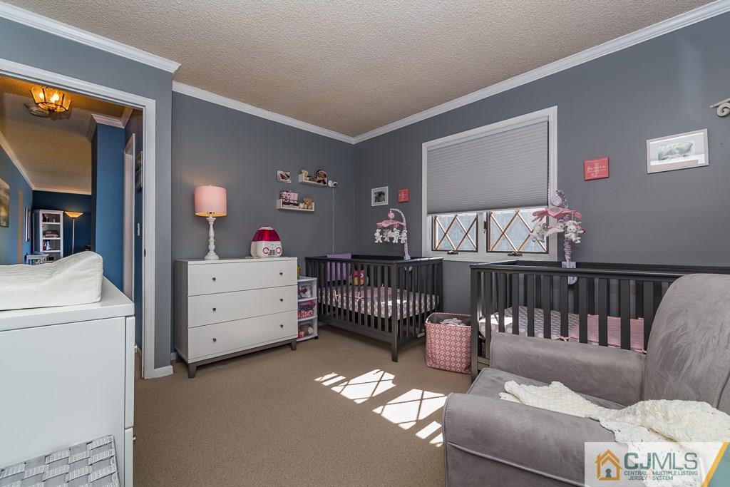 53 Rector Avenue Woodbridge, NJ 07095 - Photo 21 of 25 a bedroom with furniture and a large window