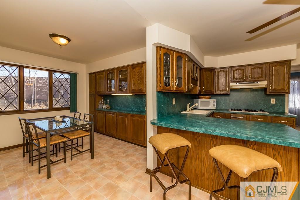 53 Rector Avenue Woodbridge, NJ 07095 - Photo 7 of 25 a view of a dinning table and chairs in the patio