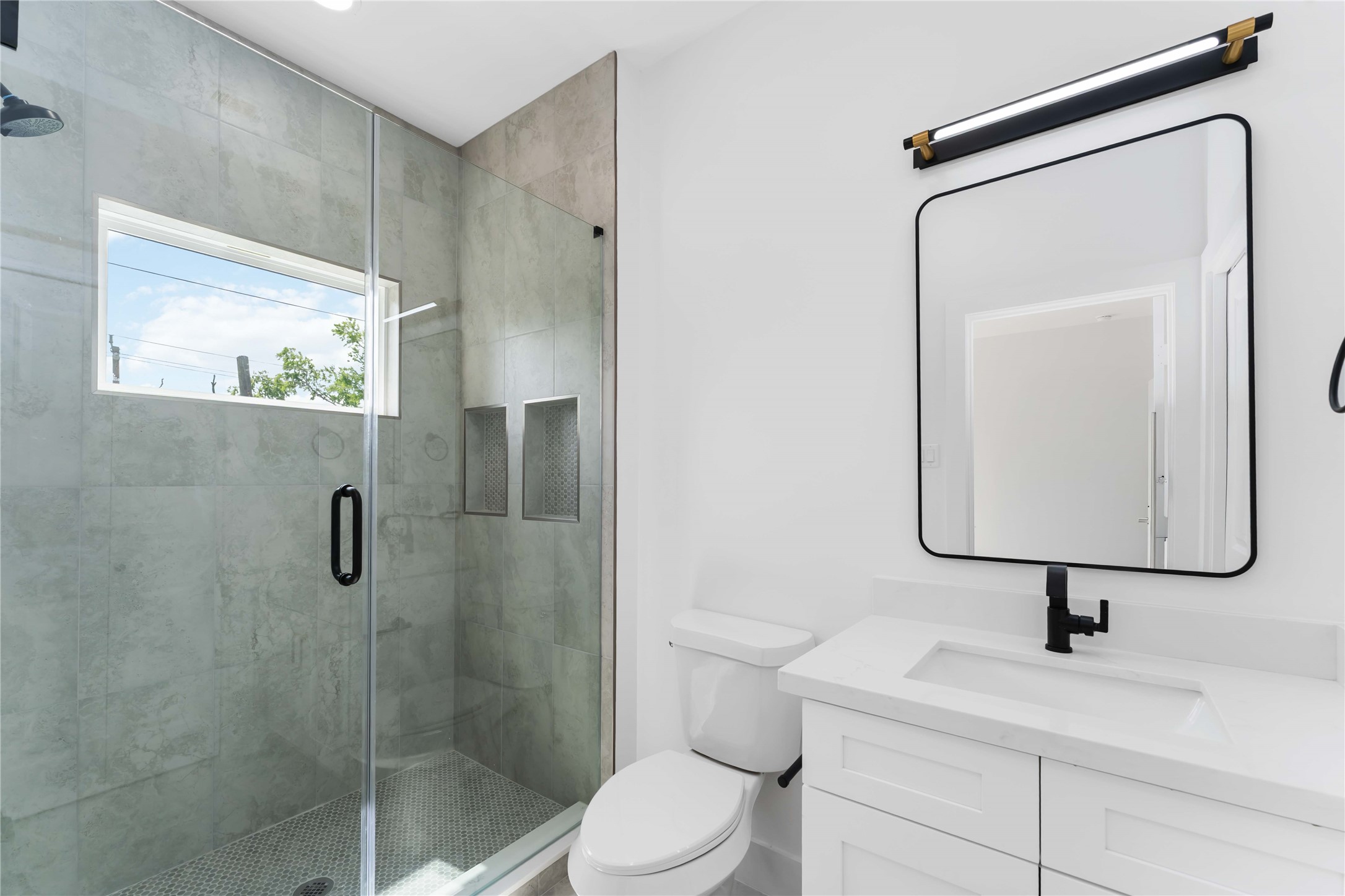 3520 Castor Street, Unit A B Houston, TX 77022 - Photo 22 of 47 a bathroom with a toilet sink and mirror