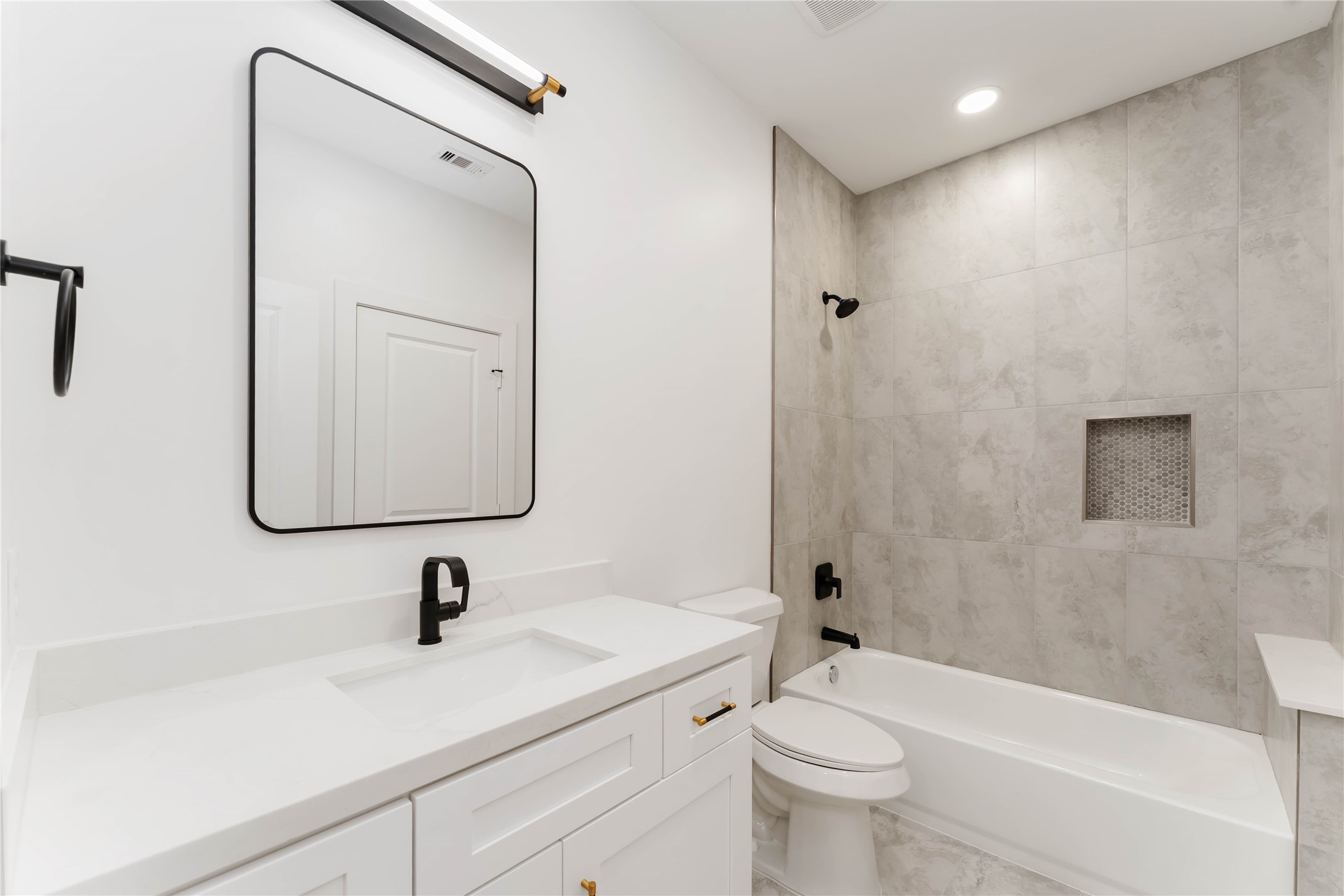 3520 Castor Street, Unit A B Houston, TX 77022 - Photo 23 of 47 a bathroom with a sink a toilet and shower