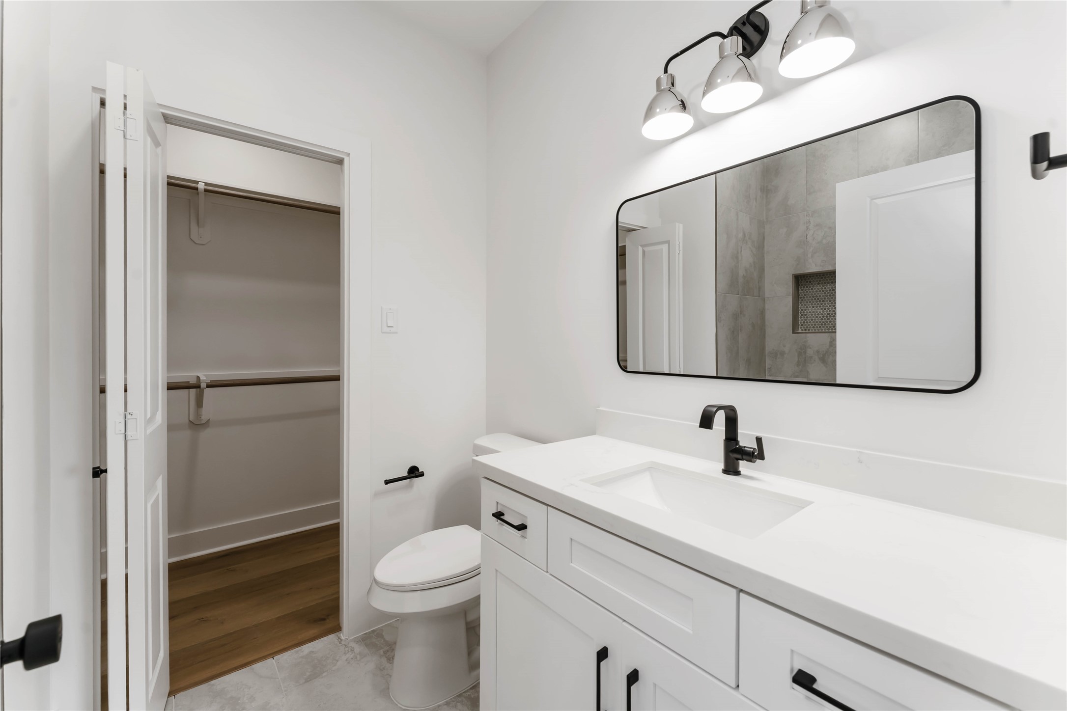 3520 Castor Street, Unit A B Houston, TX 77022 - Photo 41 of 47 a bathroom with a toilet sink and mirror