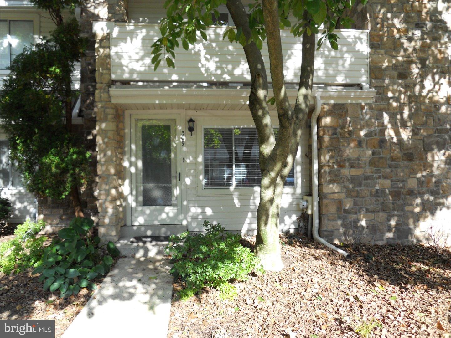 a view of a house with a tree