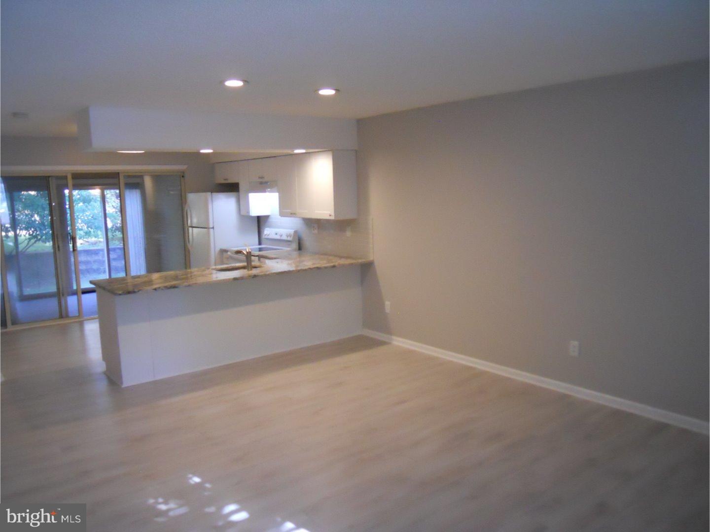 309 Headhouse Court Wayne, PA 19087 - Photo 2 of 16 a view of a kitchen with a sink and cabinets