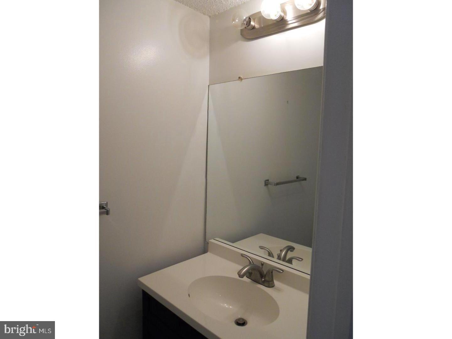 309 Headhouse Court Wayne, PA 19087 - Photo 10 of 16 a bathroom with a sink and a toilet