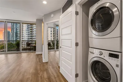 a view of a hallway with washer and dryer