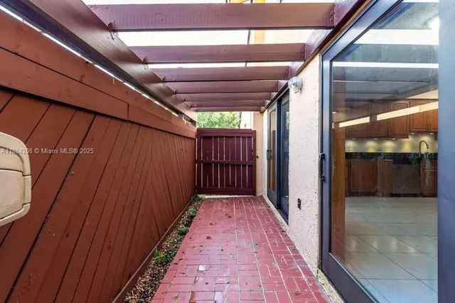 a view of a room with a black and white checkered floor