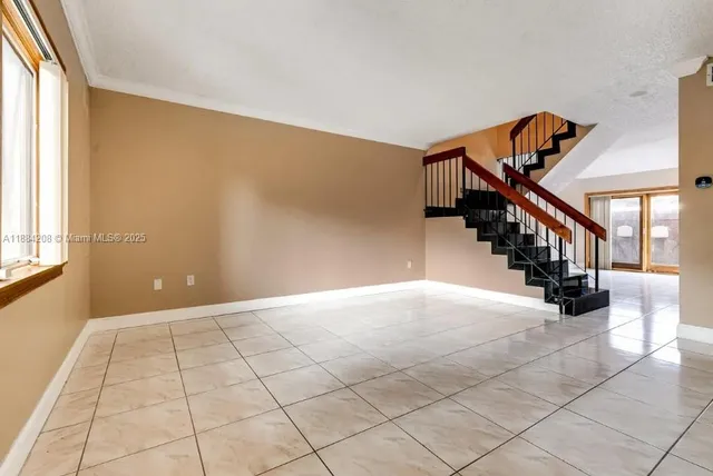 a view of a hallway with stairs