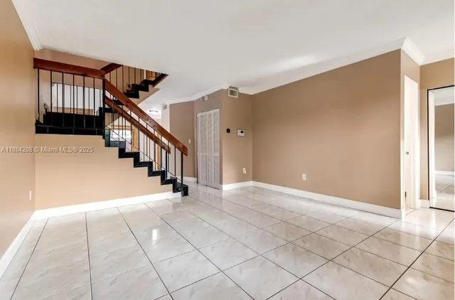 a view of an empty room with windows