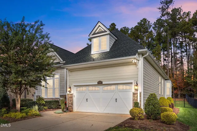 a view of house and tree in front of it