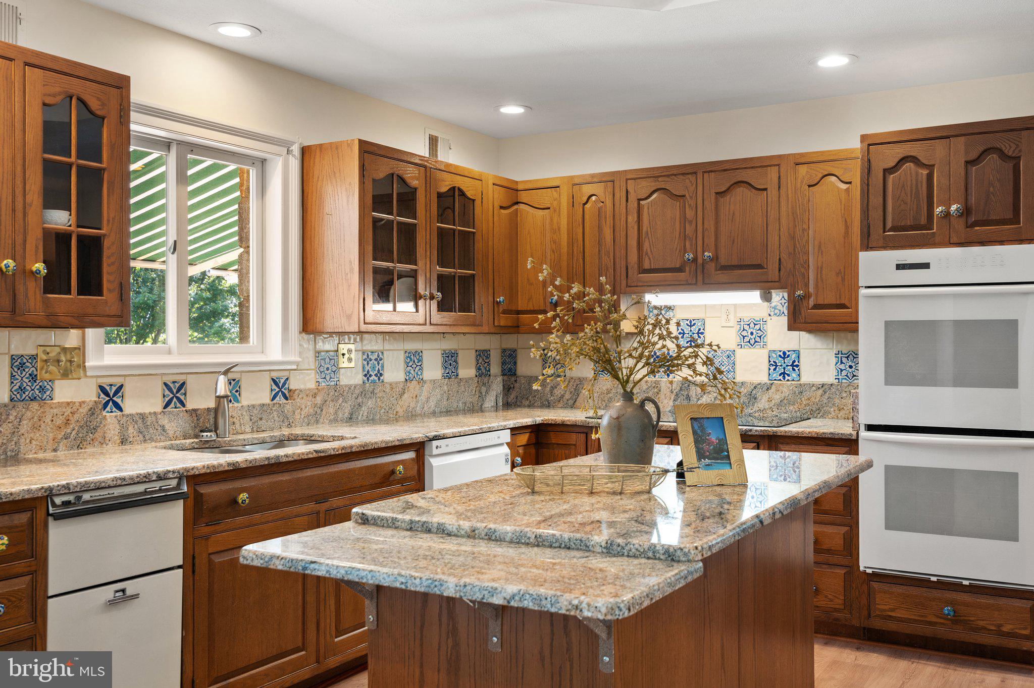 8313 Stable Gate Road Warrenton, VA 20186 - Photo 31 of 80 Granite Counters and Turkish Tile backsplash